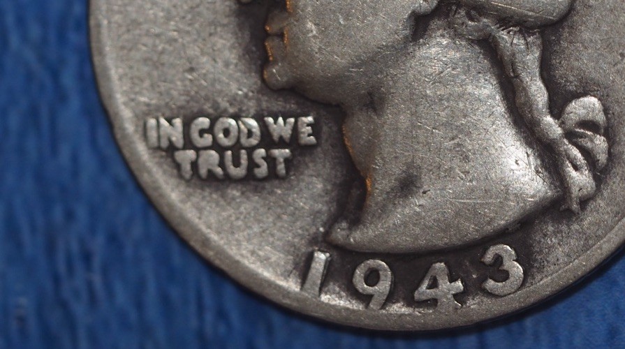 1943 quarter broadstruck error showing expanded diameter and partial rim weakness